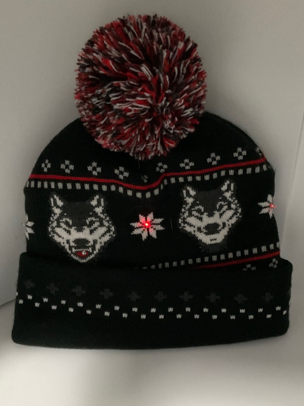 Kids Black Knit Pom Pom Beanie with Wolf Motif and Red Accent Lights Up!